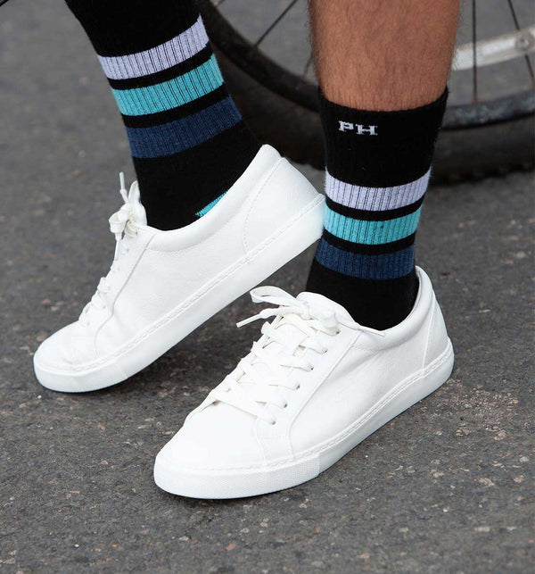 Man wearing black Striped organic cotton men's sport socks by Peper Harow